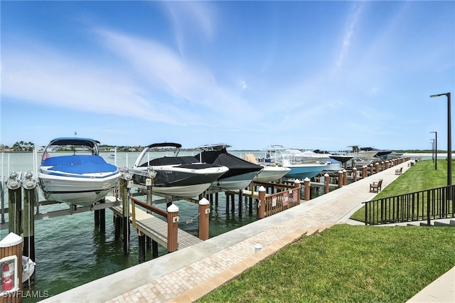 1100 S Collier Blvd Unit 723, Marco Island, FL 34145 - dock area with boat lift, a water view, and a lawn