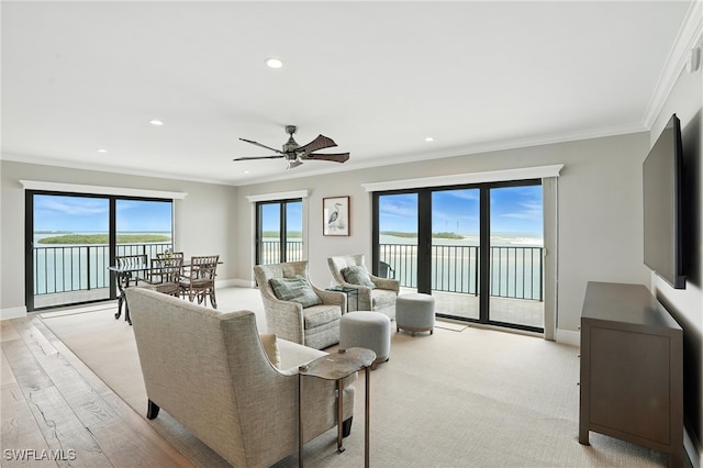 1100 S Collier Blvd Unit 723, Marco Island, FL 34145 - living room with ceiling fan, recessed lighting, a water view, crown molding, and light wood finished floors