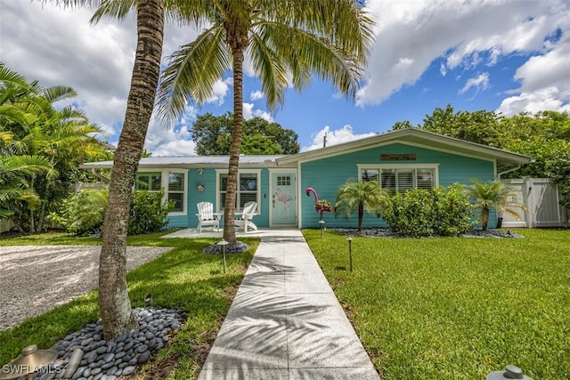 1129 8th Ter N, Naples, FL 34102 - single story home with a gate