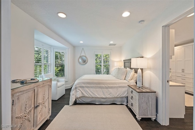 1129 8th Ter N, Naples, FL 34102 - bedroom with dark wood-style flooring and recessed lighting