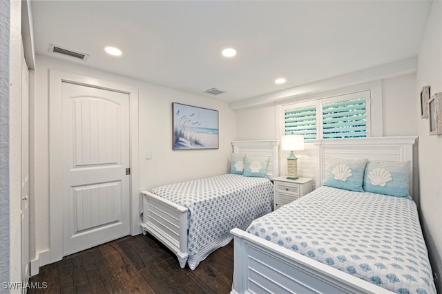 1129 8th Ter N, Naples, FL 34102 - bedroom with dark wood-style flooring and recessed lighting