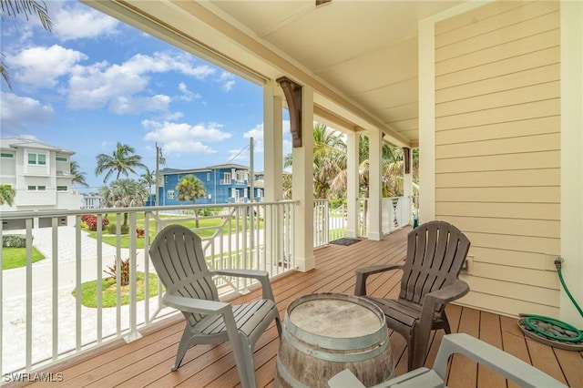 830 San Carlos Dr, Fort Myers Beach, FL 33931 - wooden terrace featuring a residential view