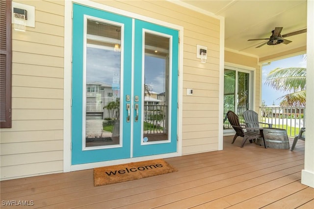 830 San Carlos Dr, Fort Myers Beach, FL 33931 - doorway to property with ceiling fan and french doors