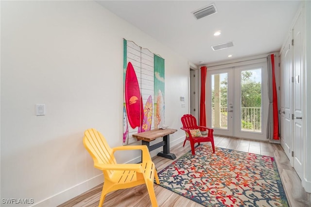 830 San Carlos Dr, Fort Myers Beach, FL 33931 - living area with french doors, light wood-style flooring, and recessed lighting