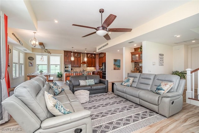 830 San Carlos Dr, Fort Myers Beach, FL 33931 - living room featuring a ceiling fan, light wood-style floors, and recessed lighting