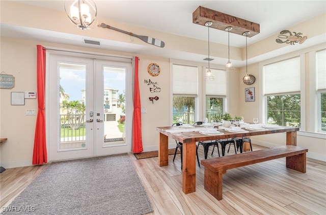 830 San Carlos Dr, Fort Myers Beach, FL 33931 - dining room featuring french doors and light wood-type flooring