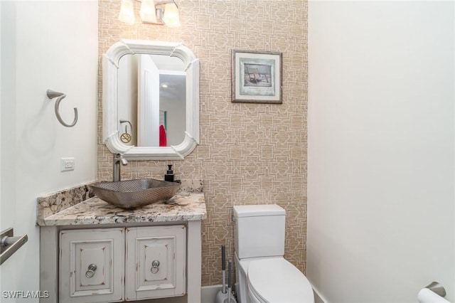 830 San Carlos Dr, Fort Myers Beach, FL 33931 - half bathroom with toilet and vanity