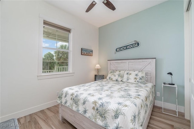 830 San Carlos Dr, Fort Myers Beach, FL 33931 - bedroom featuring wood finished floors and a ceiling fan