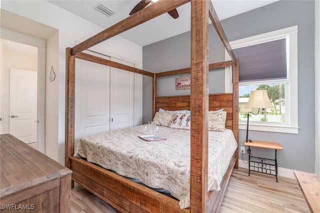 830 San Carlos Dr, Fort Myers Beach, FL 33931 - bedroom featuring a closet, wood finished floors, and ceiling fan