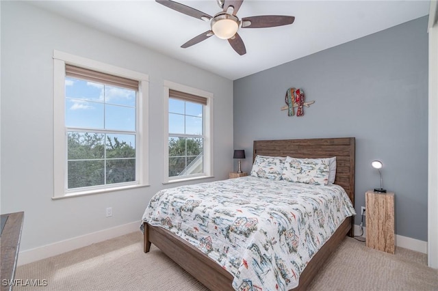 830 San Carlos Dr, Fort Myers Beach, FL 33931 - carpeted bedroom featuring baseboards and ceiling fan