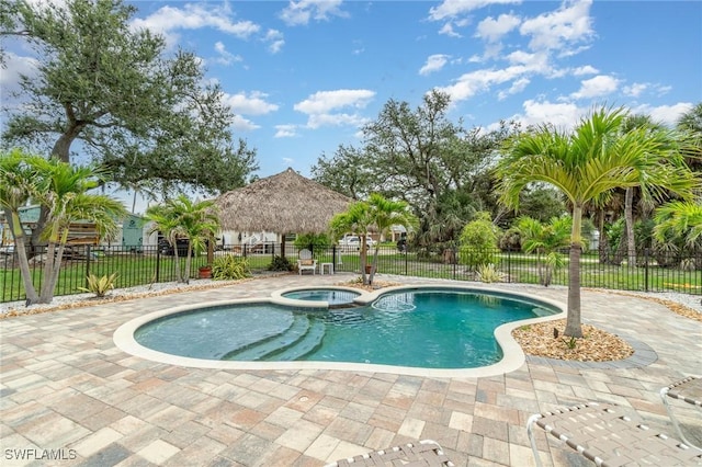 830 San Carlos Dr, Fort Myers Beach, FL 33931 - view of pool with a pool with connected hot tub, a gazebo, and a patio area