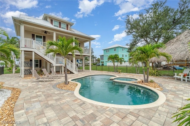 830 San Carlos Dr, Fort Myers Beach, FL 33931 - view of pool with stairs, ceiling fan, a patio area, and a pool with connected hot tub