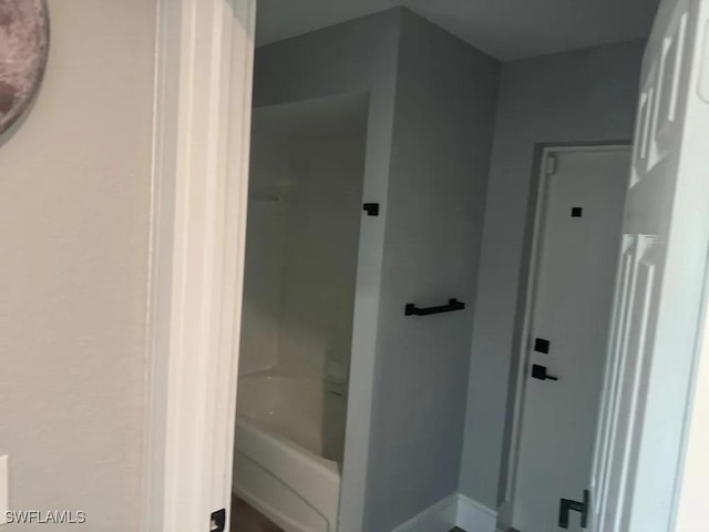 1614 SW 27th St, Cape Coral, FL 33914 - full bathroom featuring shower / bath combination and baseboards