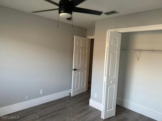 1614 SW 27th St, Cape Coral, FL 33914 - unfurnished bedroom with dark wood-type flooring, a closet, and ceiling fan