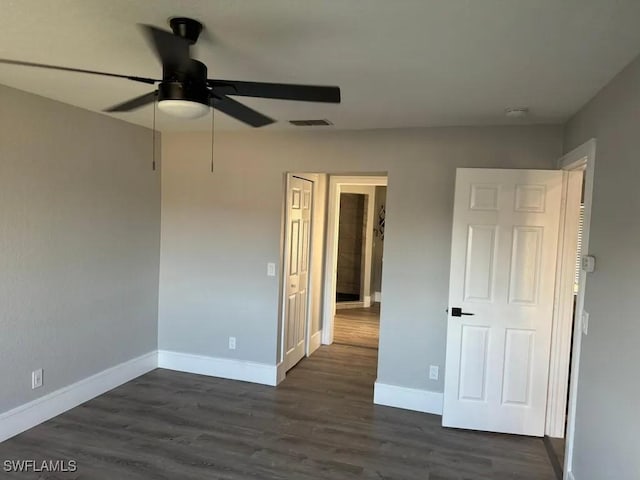 1614 SW 27th St, Cape Coral, FL 33914 - unfurnished bedroom with dark wood-style flooring and a ceiling fan