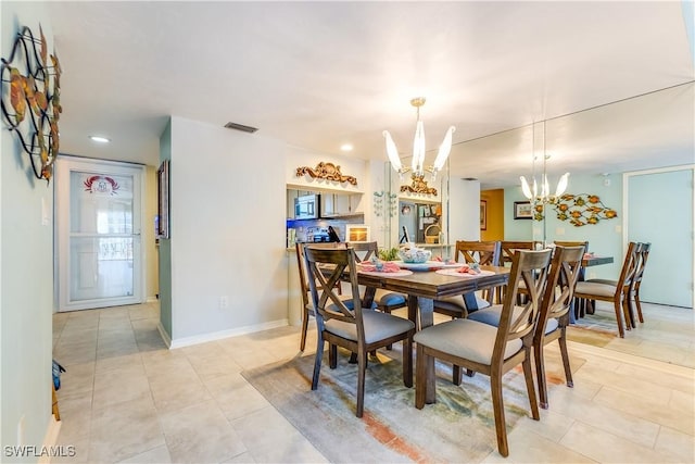 4531 Bay Beach Ln Unit 337, Fort Myers Beach, FL 33931 - dining area with a chandelier, light tile patterned floors, and recessed lighting