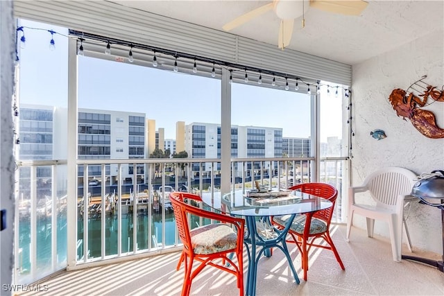 4531 Bay Beach Ln Unit 337, Fort Myers Beach, FL 33931 - sunroom / solarium featuring a view of city and a water view