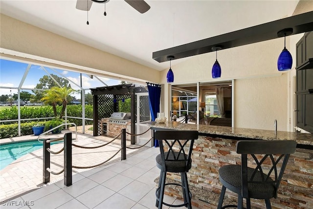 2322 River Reach Dr, Naples, FL 34104 - view of patio / terrace featuring a bar, exterior kitchen, a lanai, and ceiling fan