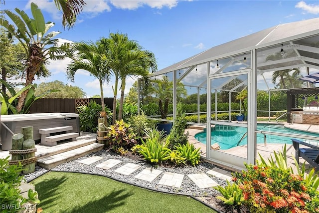 2322 River Reach Dr, Naples, FL 34104 - swimming pool with a hot tub, a patio, and glass enclosure
