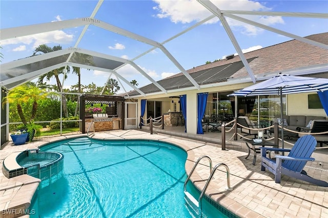 2322 River Reach Dr, Naples, FL 34104 - view of swimming pool with an outdoor kitchen, a patio, a pool with connected hot tub, and glass enclosure