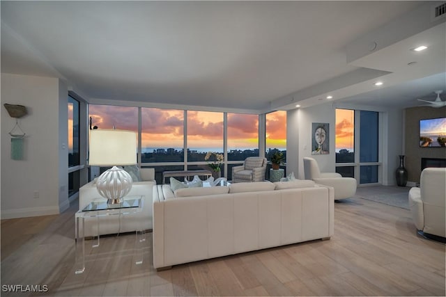 7515 Pelican Bay Blvd Unit 8A, Naples, FL 34108 - living room with a wall of windows, wood finished floors, and recessed lighting