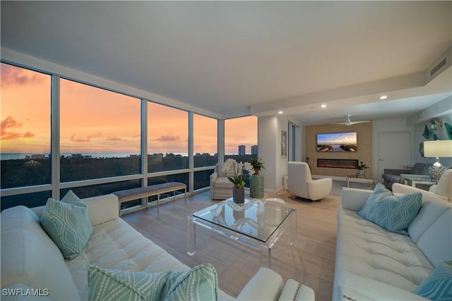 7515 Pelican Bay Blvd Unit 8A, Naples, FL 34108 - living room with recessed lighting, a wall of windows, and wood finished floors