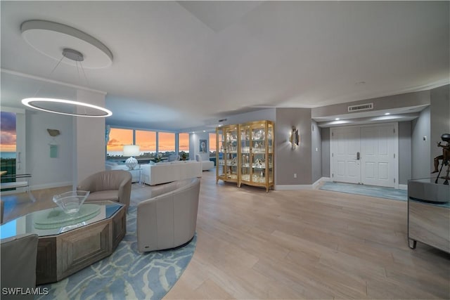 7515 Pelican Bay Blvd Unit 8A, Naples, FL 34108 - living area featuring wood finished floors and baseboards