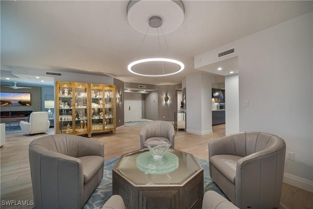 7515 Pelican Bay Blvd Unit 8A, Naples, FL 34108 - living room featuring light wood-type flooring