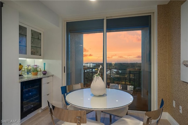 7515 Pelican Bay Blvd Unit 8A, Naples, FL 34108 - dining room with wine cooler and a dry bar