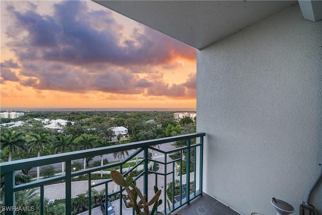 7515 Pelican Bay Blvd Unit 8A, Naples, FL 34108 - view of balcony at dusk