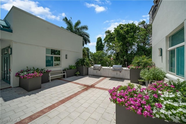 7515 Pelican Bay Blvd Unit 8A, Naples, FL 34108 - view of patio with exterior kitchen