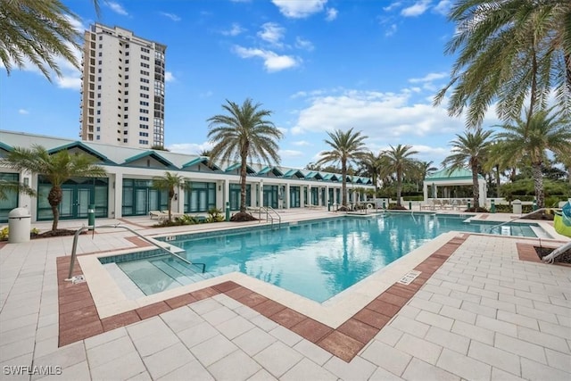 7515 Pelican Bay Blvd Unit 8A, Naples, FL 34108 - community pool featuring a patio area and a hot tub