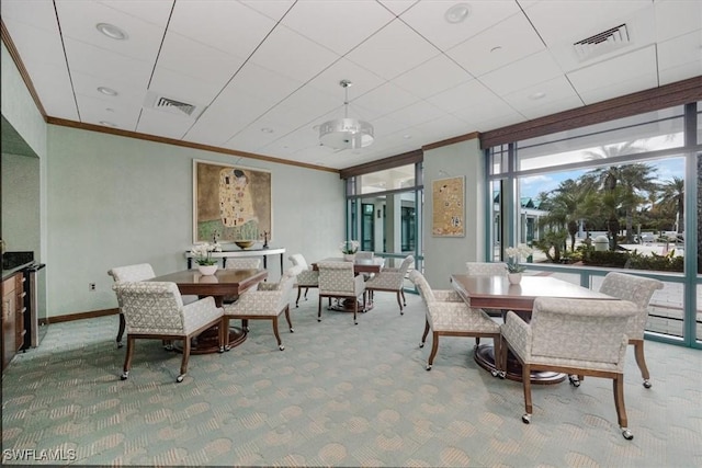 7515 Pelican Bay Blvd Unit 8A, Naples, FL 34108 - dining space featuring crown molding and carpet