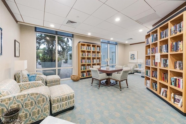 7515 Pelican Bay Blvd Unit 8A, Naples, FL 34108 - sitting room featuring carpet flooring, ornamental molding, and recessed lighting