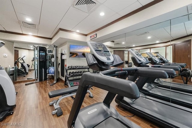 7515 Pelican Bay Blvd Unit 8A, Naples, FL 34108 - gym featuring crown molding and wood finished floors