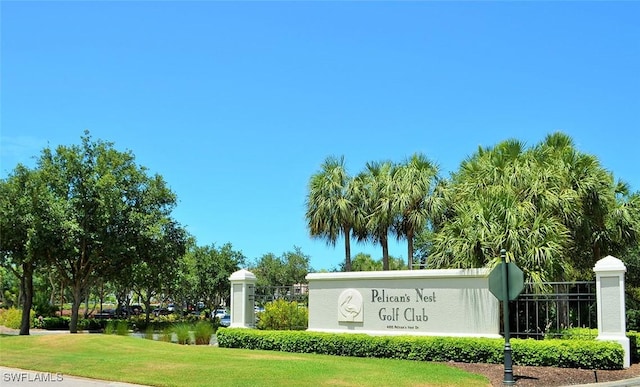 24320 Sandpiper Isle Way Unit 202, Bonita Springs, FL 34134 - community / neighborhood sign with a lawn