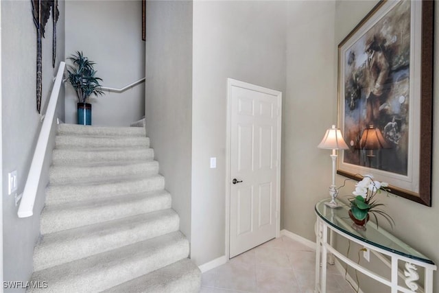 24320 Sandpiper Isle Way Unit 202, Bonita Springs, FL 34134 - stairway featuring tile patterned floors and baseboards