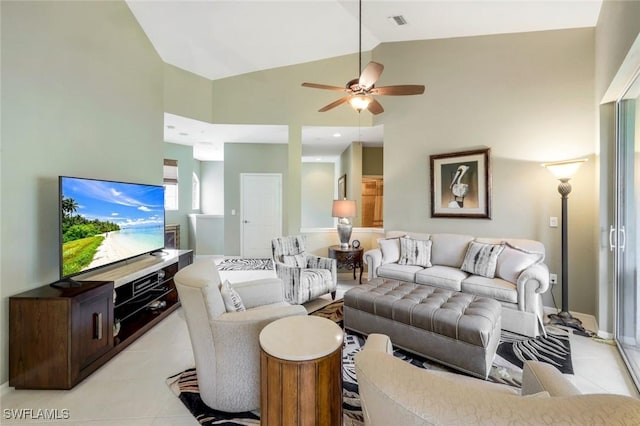 24320 Sandpiper Isle Way Unit 202, Bonita Springs, FL 34134 - living area with light tile patterned flooring, ceiling fan, and high vaulted ceiling