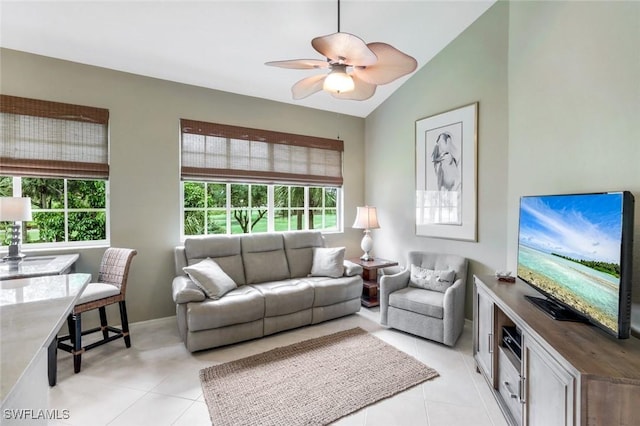 24320 Sandpiper Isle Way Unit 202, Bonita Springs, FL 34134 - living room with plenty of natural light, lofted ceiling, a ceiling fan, and light tile patterned floors
