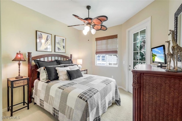24320 Sandpiper Isle Way Unit 202, Bonita Springs, FL 34134 - bedroom with light colored carpet and ceiling fan