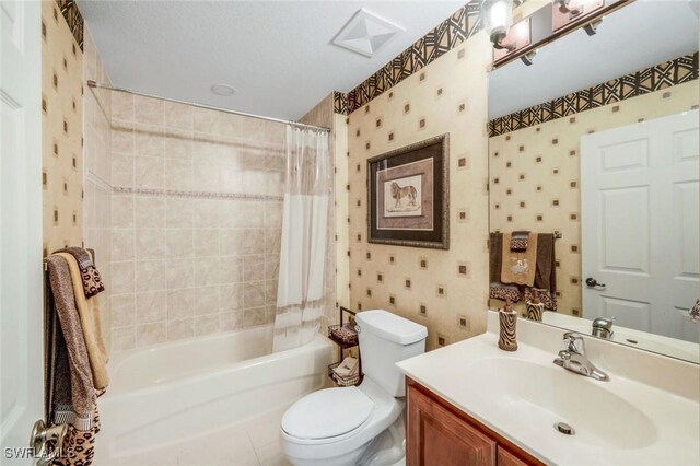 24320 Sandpiper Isle Way Unit 202, Bonita Springs, FL 34134 - full bathroom featuring shower / bath combo, vanity, and wallpapered walls