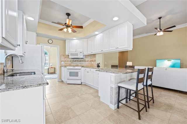 28864 Yellow Fin Trl, Bonita Springs, FL 34135 - kitchen with white appliances, ceiling fan, a peninsula, backsplash, and ornamental molding