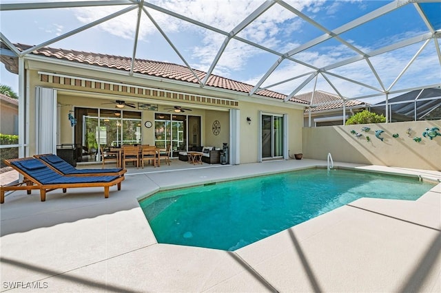 28864 Yellow Fin Trl, Bonita Springs, FL 34135 - view of pool featuring a patio area, ceiling fan, an outdoor hangout area, and glass enclosure