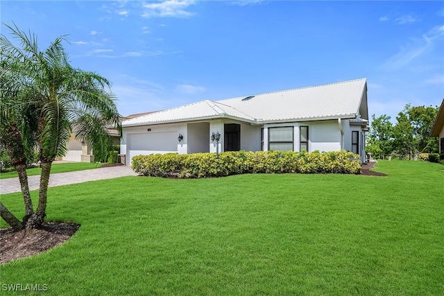 221 Saint James Way, Naples, FL 34104 - ranch-style house with driveway, stucco siding, a front lawn, and an attached garage