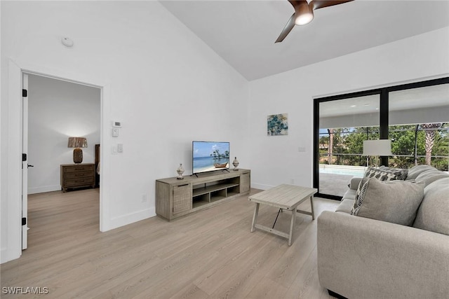 221 Saint James Way, Naples, FL 34104 - living area with light wood finished floors, a ceiling fan, and high vaulted ceiling