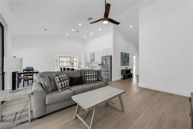221 Saint James Way, Naples, FL 34104 - living area with a ceiling fan, high vaulted ceiling, recessed lighting, and light wood finished floors