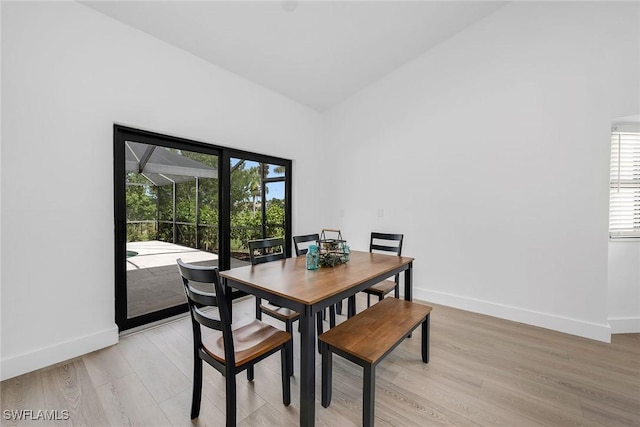221 Saint James Way, Naples, FL 34104 - dining area with light wood finished floors, healthy amount of natural light, and a sunroom