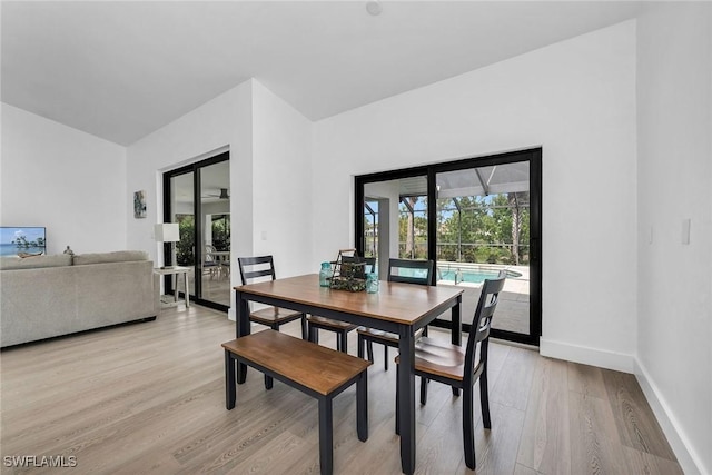 221 Saint James Way, Naples, FL 34104 - dining room featuring light wood-style floors and baseboards