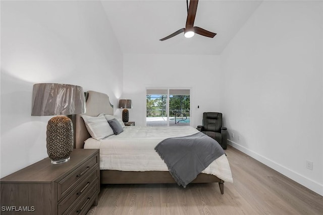 221 Saint James Way, Naples, FL 34104 - bedroom featuring access to outside, light wood-style flooring, a ceiling fan, and high vaulted ceiling