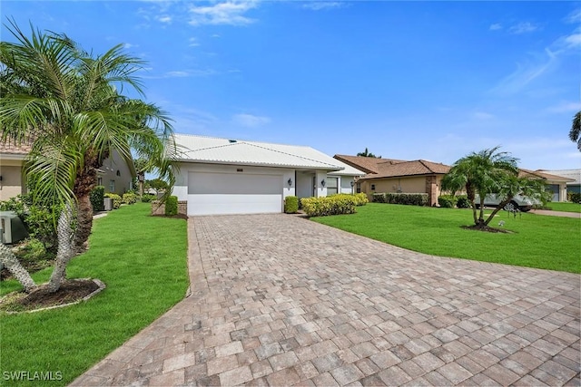 221 Saint James Way, Naples, FL 34104 - ranch-style home featuring decorative driveway, a front yard, an attached garage, and stucco siding